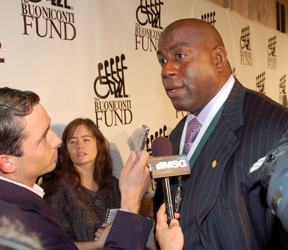 Former NBA point guard Earvin Johnson talks with the assembled media at the Great Legends of Sports Dinner at the Waldorf-Astoria in New York.