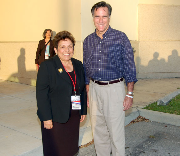 UM President Donna Shalala chats up ex-Massachusetts Governor Mitt Romney outside the Bank United Center before the GOP debate in Coral Gables, Fla.