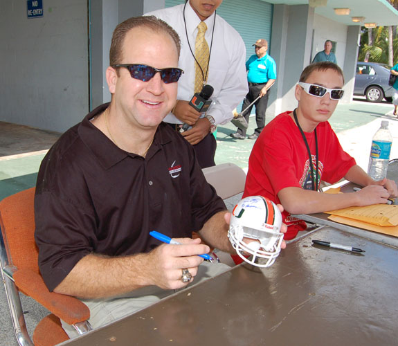 Gino Torretta, who is best known for winning the Heisman Trophy in 1992, signs autographs for fans at the Orange Bowl closing ceremonies.