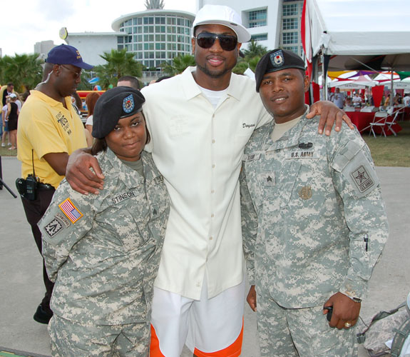 Miami Heat guard Dwyane Wade spends time with U.S. military personnel during the team's annual Family Fest celebration.