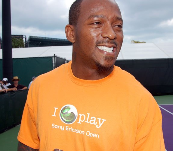 Baltimore Ravens running back Willis McGahee is all smiles as he takes on Elena Dementieva in an exhibition tennis match at Crandon Park on Key Biscayne.