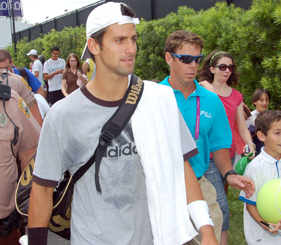 Novak Djokovic walks toward his practice court in the middle of adoring fans during Day One of the Sony Ericsson Open at Crandon Park on Key Biscayne.