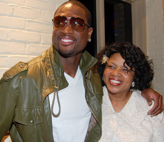 Miami Heat guard Dwyane Wade shares an embrace with his mother, Jolinda, at the grand opening party for D. Wade's Sports Grille in Ft. Lauderdale.