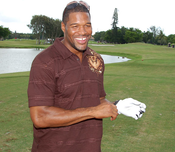 New York Giants defensive end Michael Strahan jokes around with guests on the Blue Monster at Zo's Summer Groove in Doral, Fla.