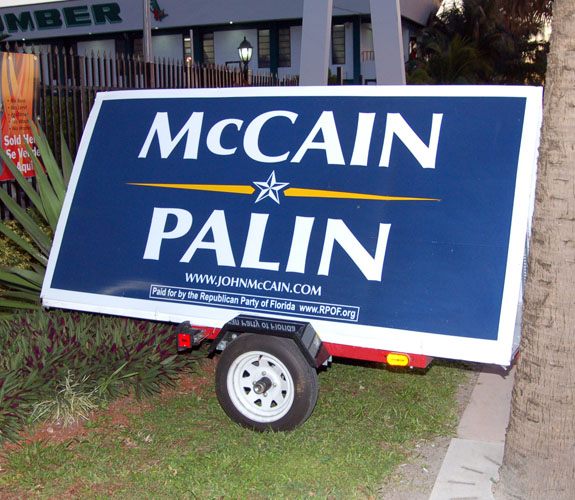 Supporters anchored signs in the ground near the lumber yard where Arizona senior senator John S. McCain spoke just days before the 2008 presidential election.