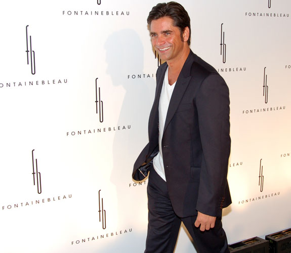 Actor John Stamos on the red carpet en route to the Fontainebleau Resort's grand re-opening party on Miami Beach.