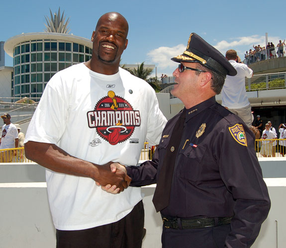 Miami Beach Chief of Police John Timoney congratulates Miami Heat center Shaquille O'Neal before the start of the team's NBA Championship Parade.