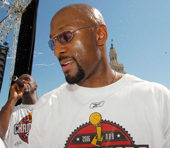 Miami Heat reserve center Alonzo Mourning celebrates with teammates during the team's NBA Championship Parade at the AmericanAirlines Arena.