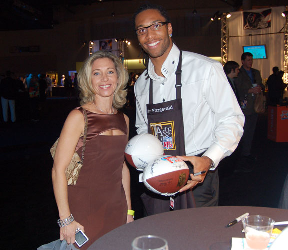 Arizona Cardinals wide receiver Larry Fitzgerald mingles with guests at the $500-per-plate Taste of the NFL on the eve of Super Bowl XLI.