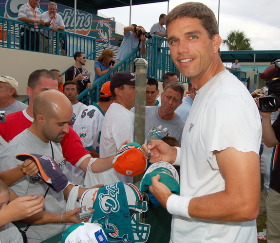 Newly acquired Miami Dolphins quarterback Trent Green signing autographs for fans after practice in Davie, Fla.
