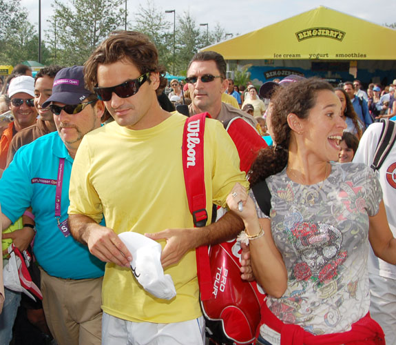 Roger Federer heads to his practice court amid of sea of admirers during Day One of the Sony Ericsson Open at Crandon Park on Key Biscayne.
